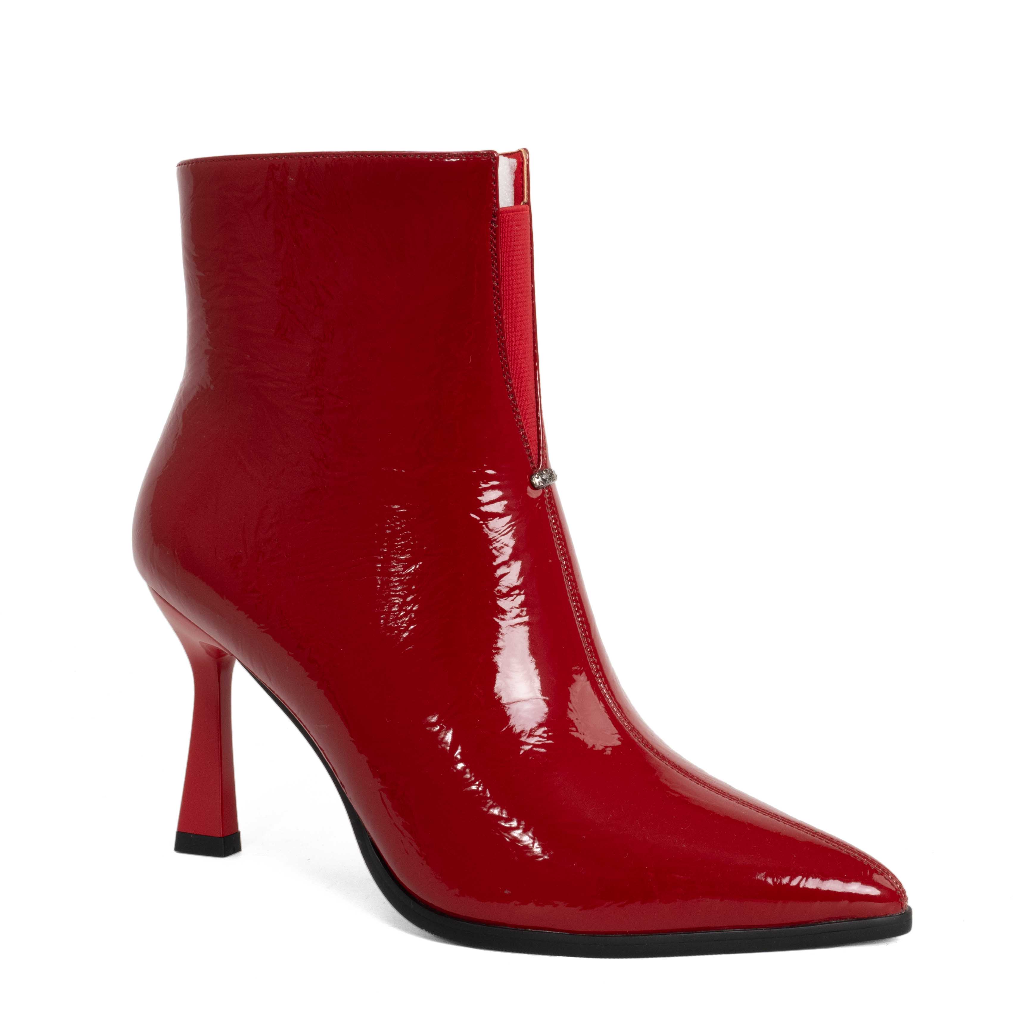 Step into elegance with Red Patent leather Women heeled boots. Perfect for any occasion, these stylish shoes combine comfort effortlessly