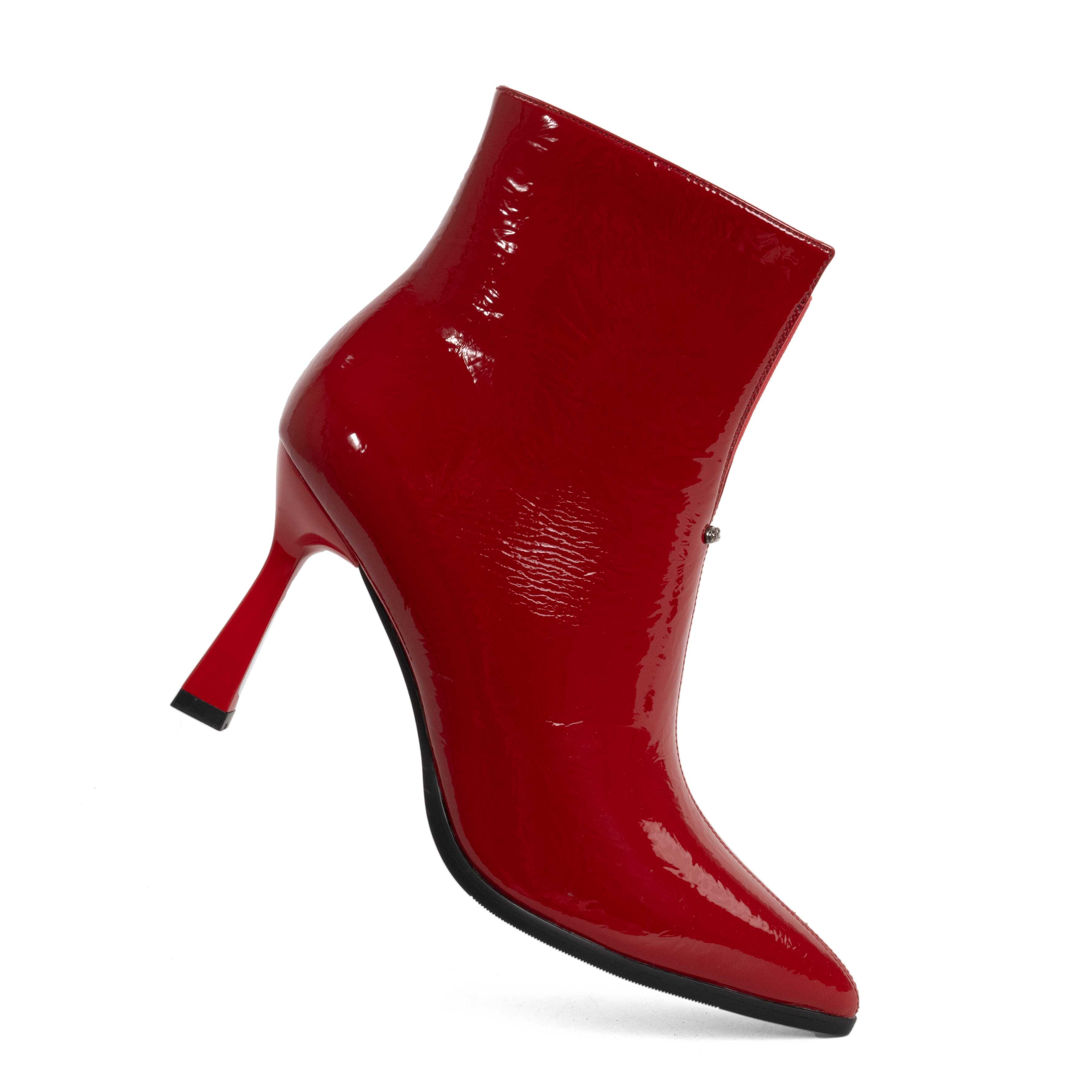 Step into elegance with Red Patent leather Women heeled boots. Perfect for any occasion, these stylish shoes combine comfort effortlessly